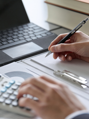 Hand of a man studying money-related qualifications
